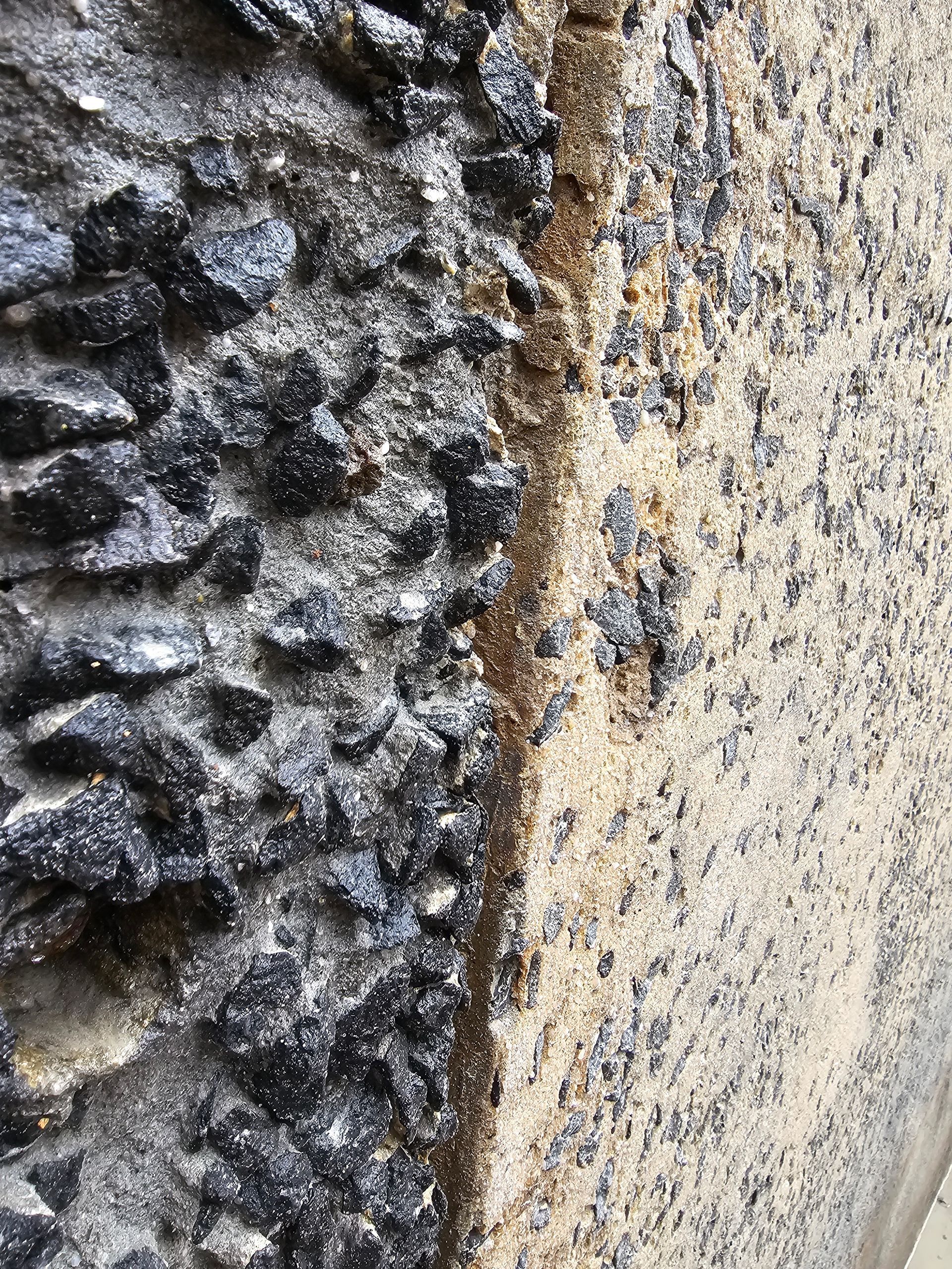 a close-up view of cracked concrete pavement