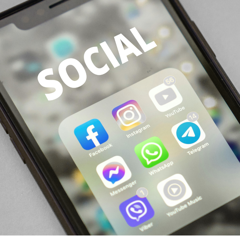 A cell phone with the word SOCIAL at the top showing different social media apps such as Facebook, Instagram, Youtube, Messenger, WhatsApp, Telegram, Viber and  Youtube Music