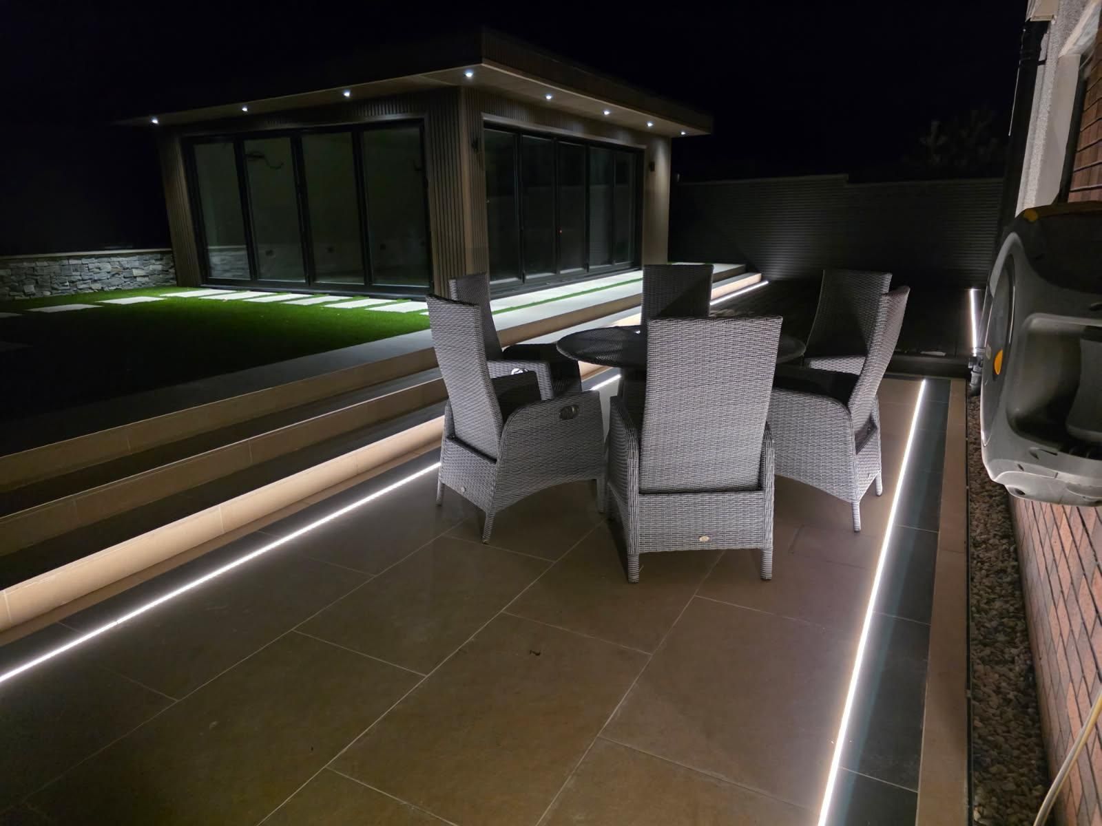 Large garden room in Newton Mearns with 10m x 5m covered entertainment space, featuring a stylish bar and private toilet, designed for outdoor living.
