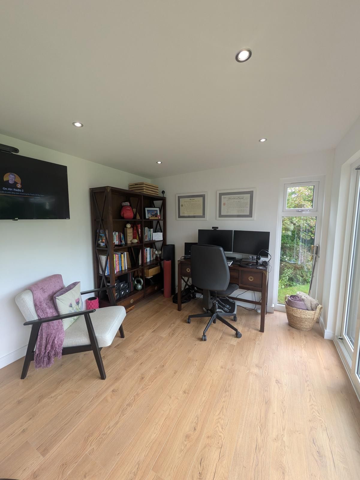Modern interior of a garden games room with toilet, underfloor heating, and a 3m x 1.5m double-glazed roof lantern providing natural light throughout