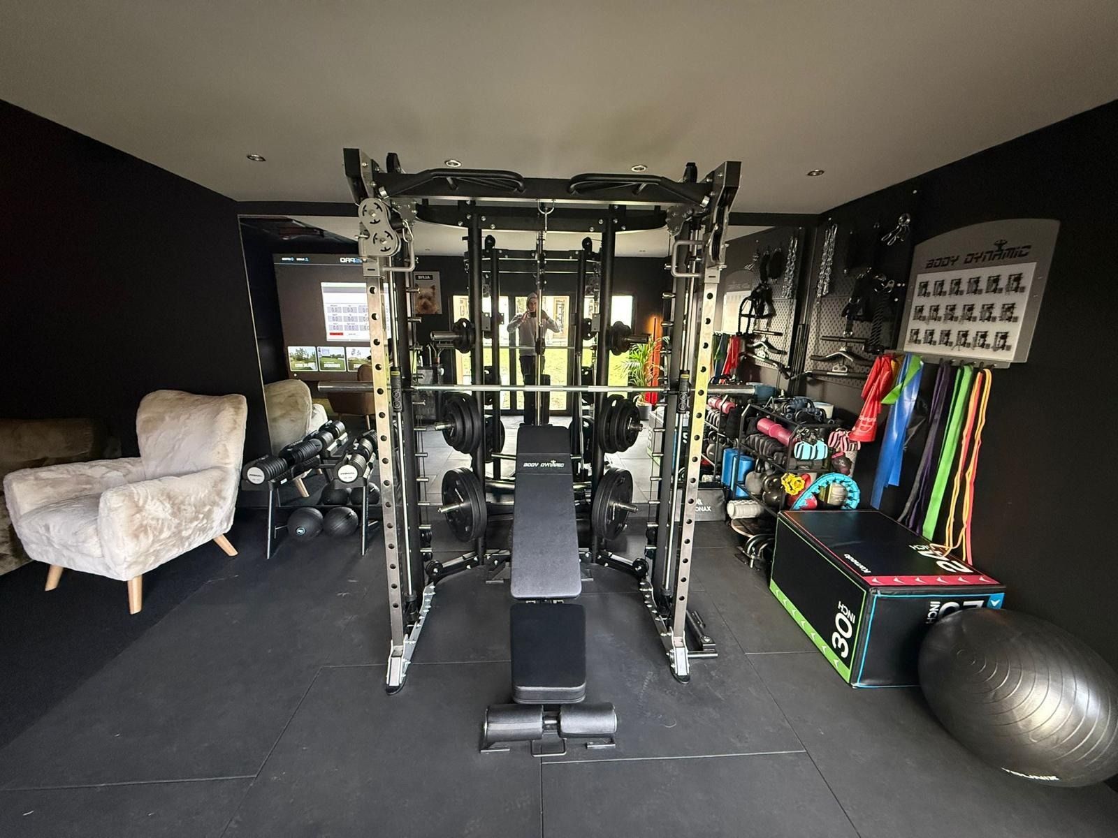 Golf simulator and gym garden room designed by Oakspan for year-round practice and training