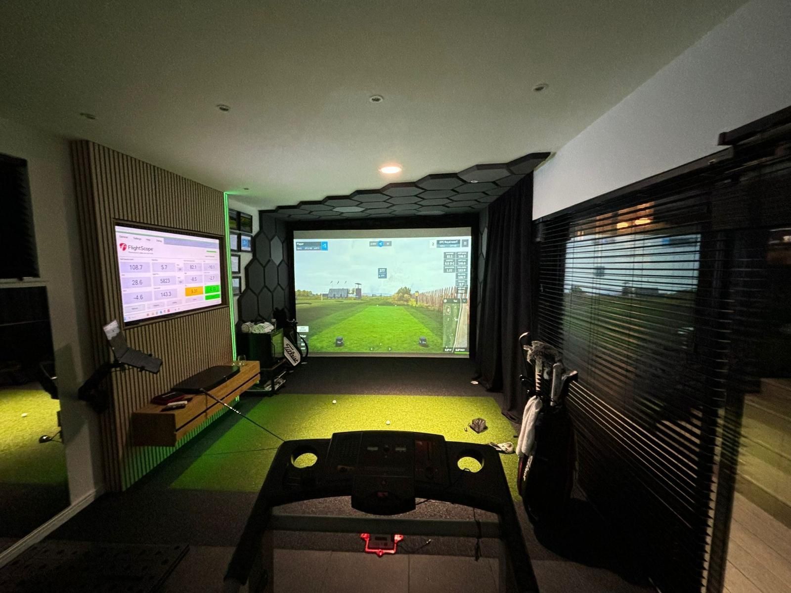 Golf simulator in use inside an Oakspan garden room