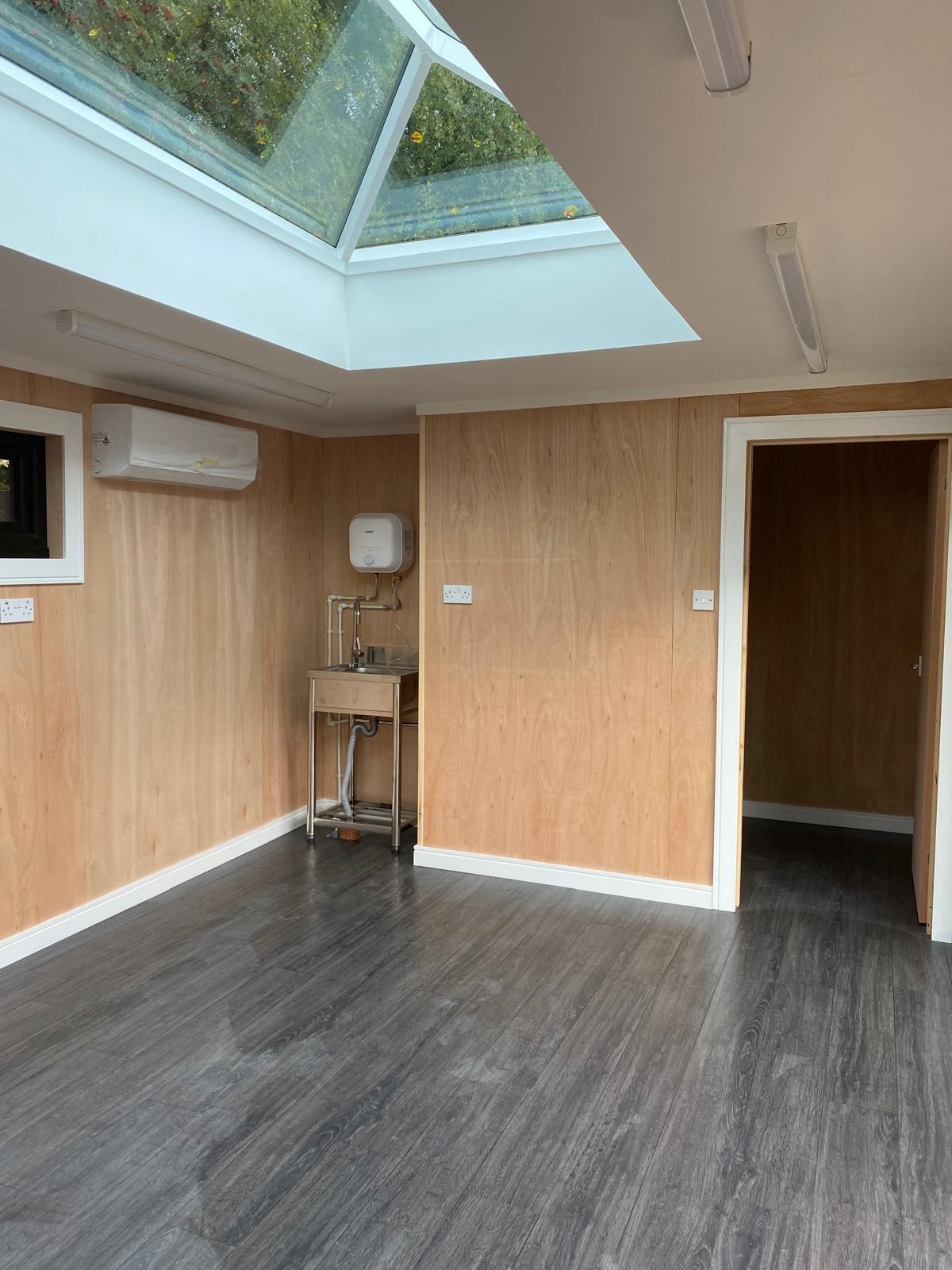 Insulated Oakspan garden art studio interior with roof lantern and natural light