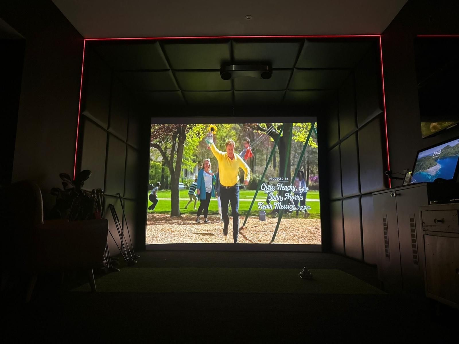 Finished interior of the Kilmarnock Oakspan showing the golf simulator and adjoining home gym