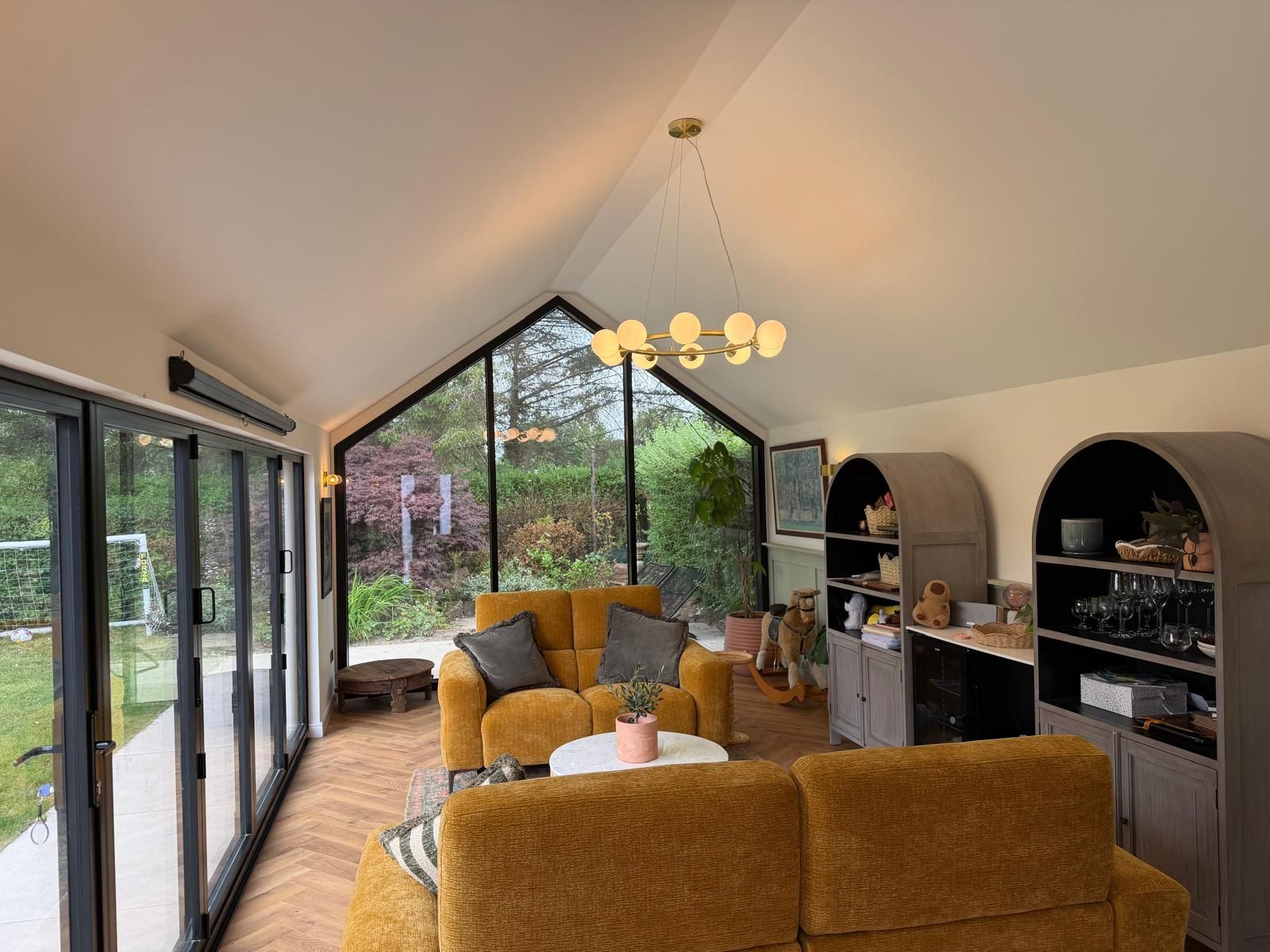 Interior of Oakspan pitched roof garden room in Newton Mearns with vaulted ceiling and glazed doors