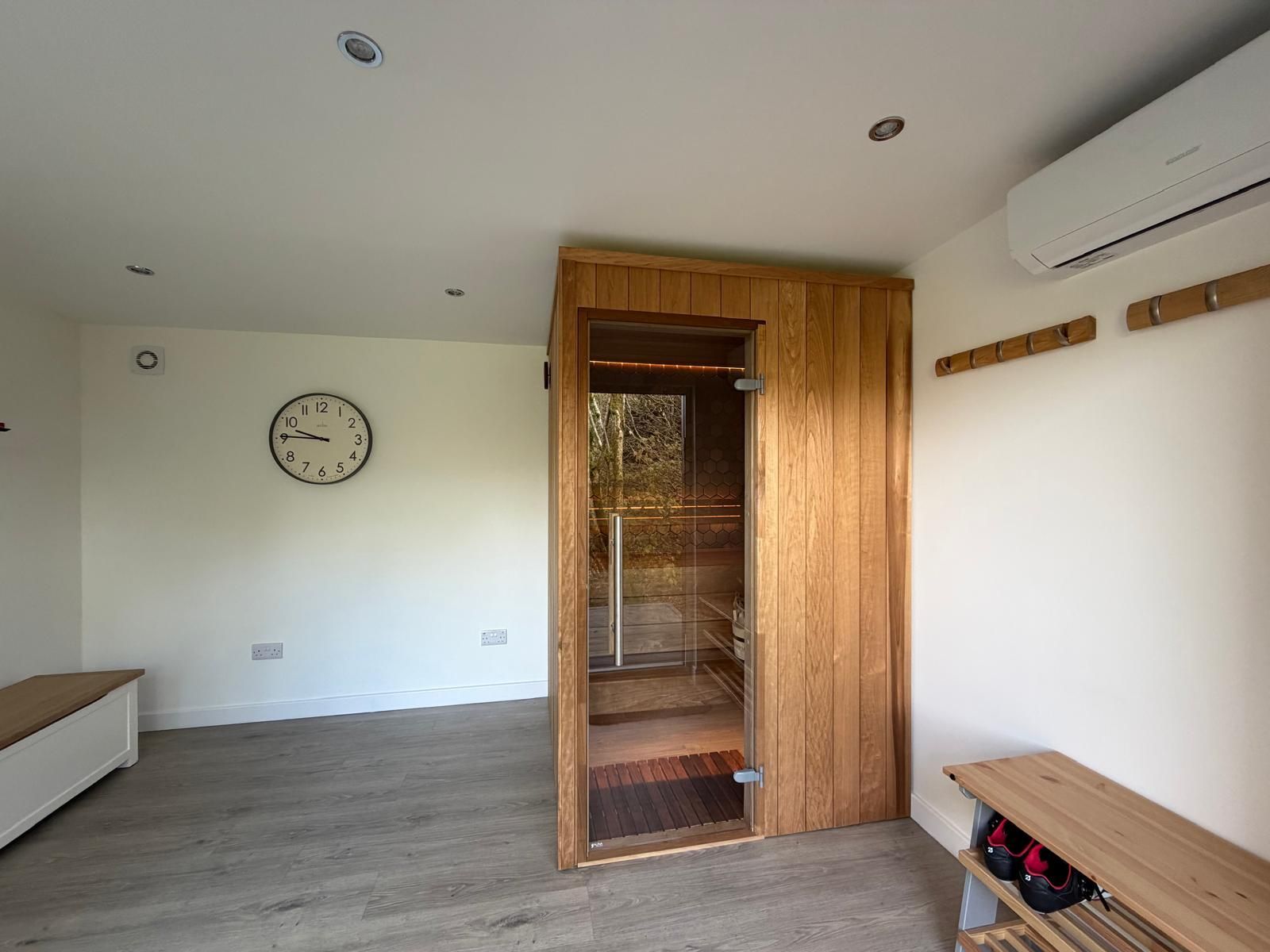 Interior of a 4m x 3m Oakspan garden room with integrated timber sauna and air conditioning