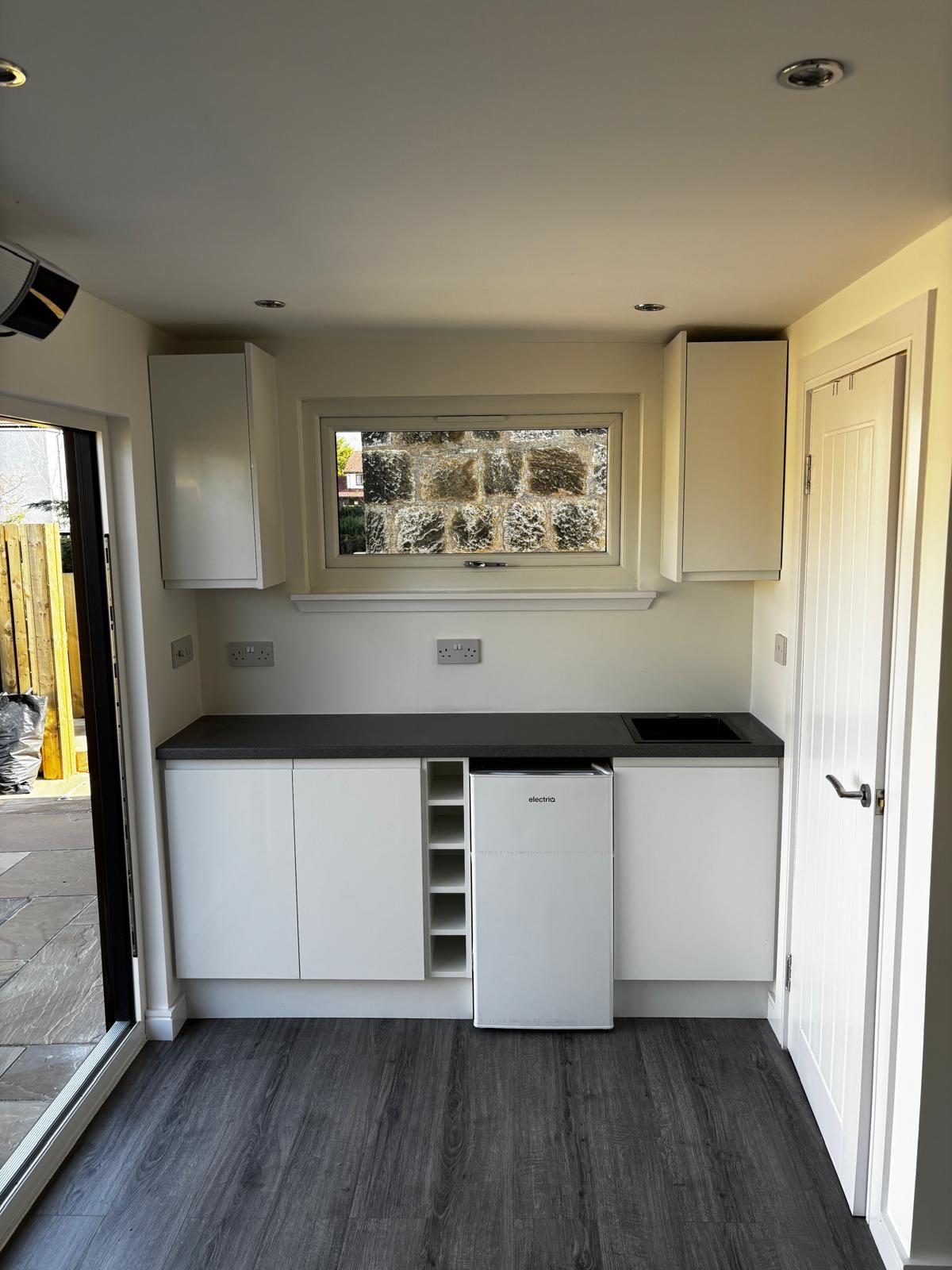 Fitted kitchen inside a compact Oakspan mini annexe garden room in Chryston