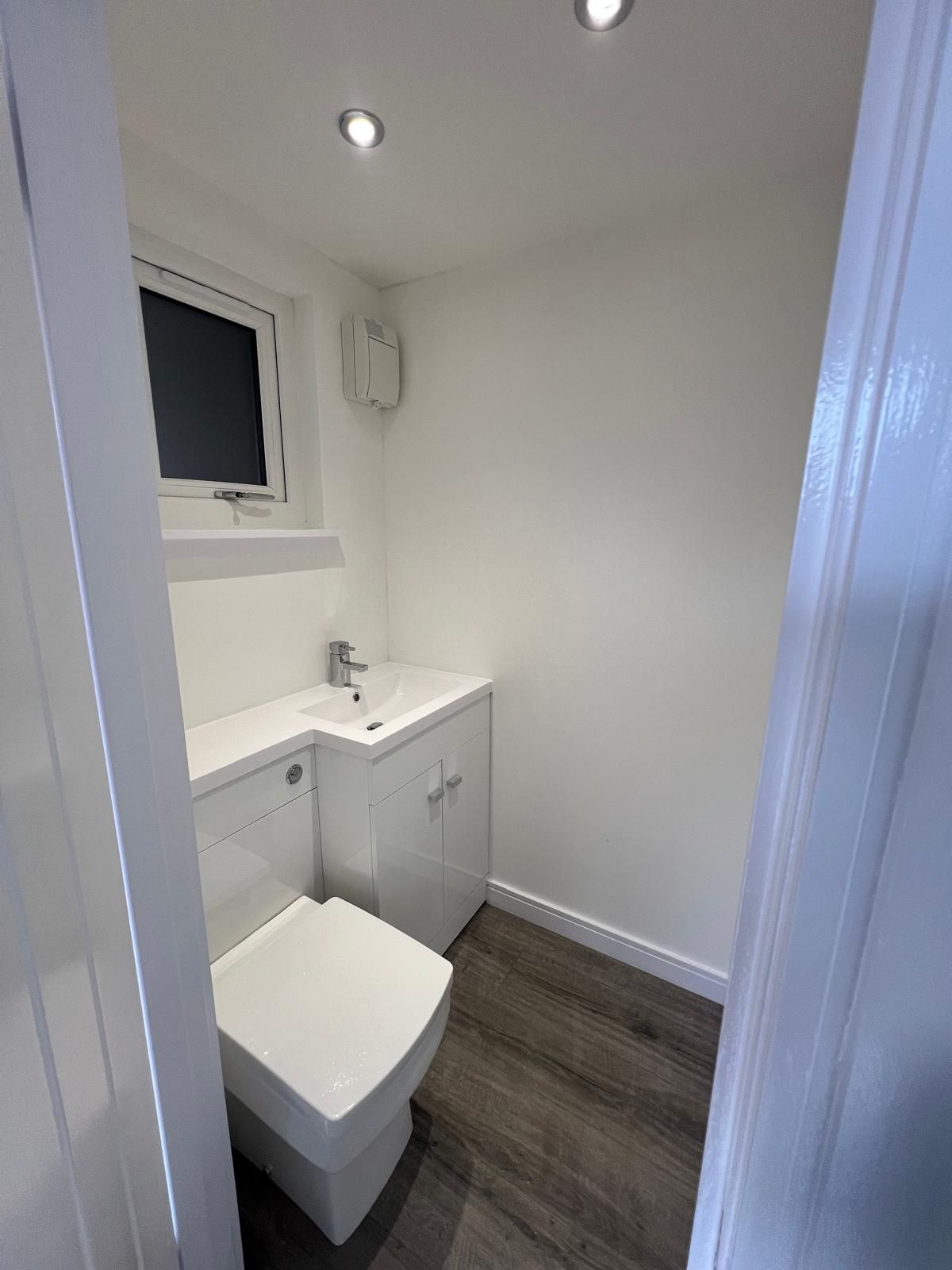 Integrated toilet and wash basin inside the Oakspan mini annexe garden room in Chryston