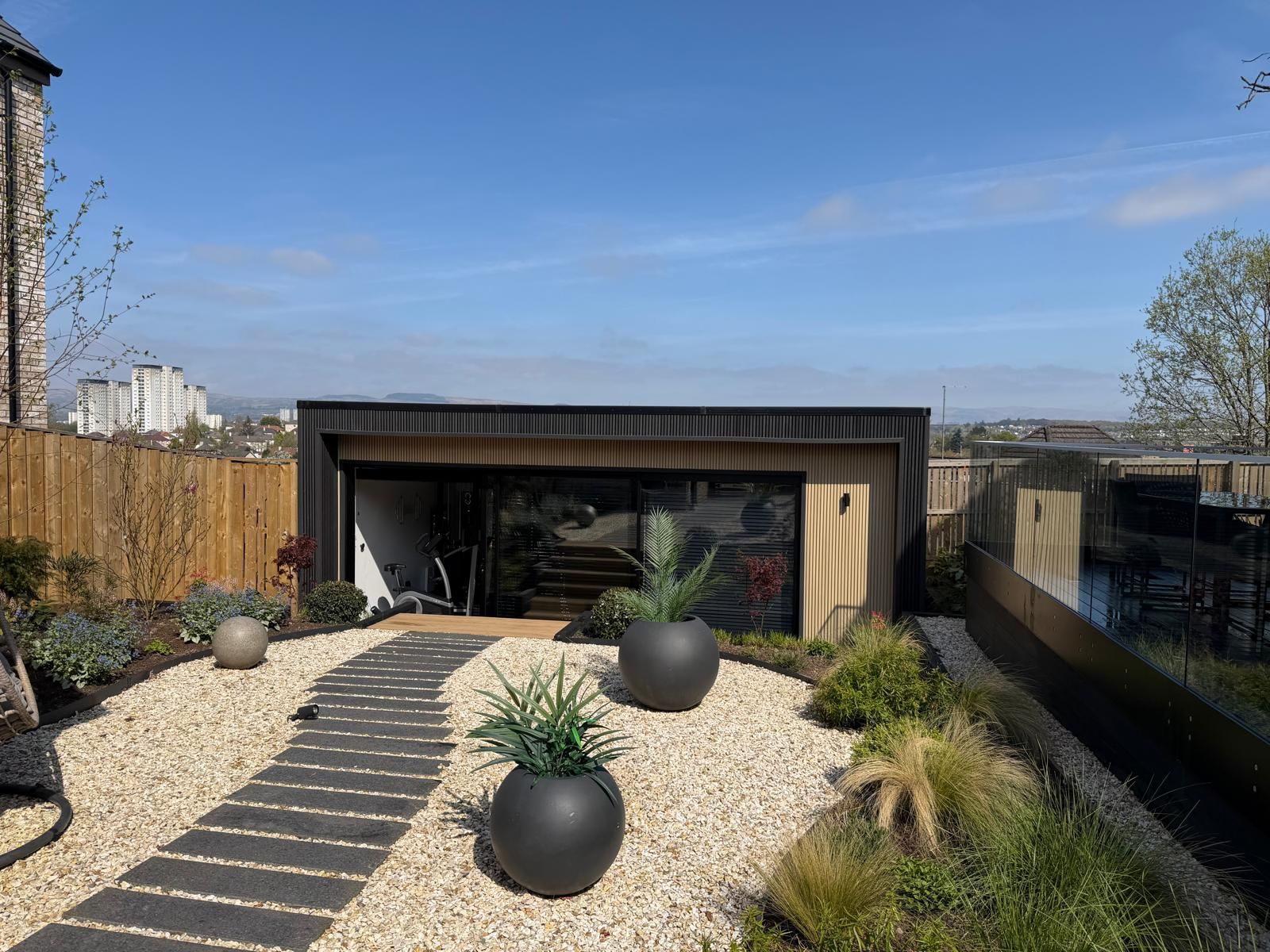 Landscaped garden with bespoke Oakspan golf simulator garden room in Jordanhill Glasgow