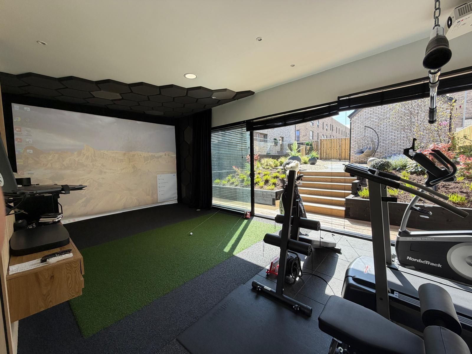 Golf simulator and gym inside an Oakspan garden room in Jordanhill Glasgow