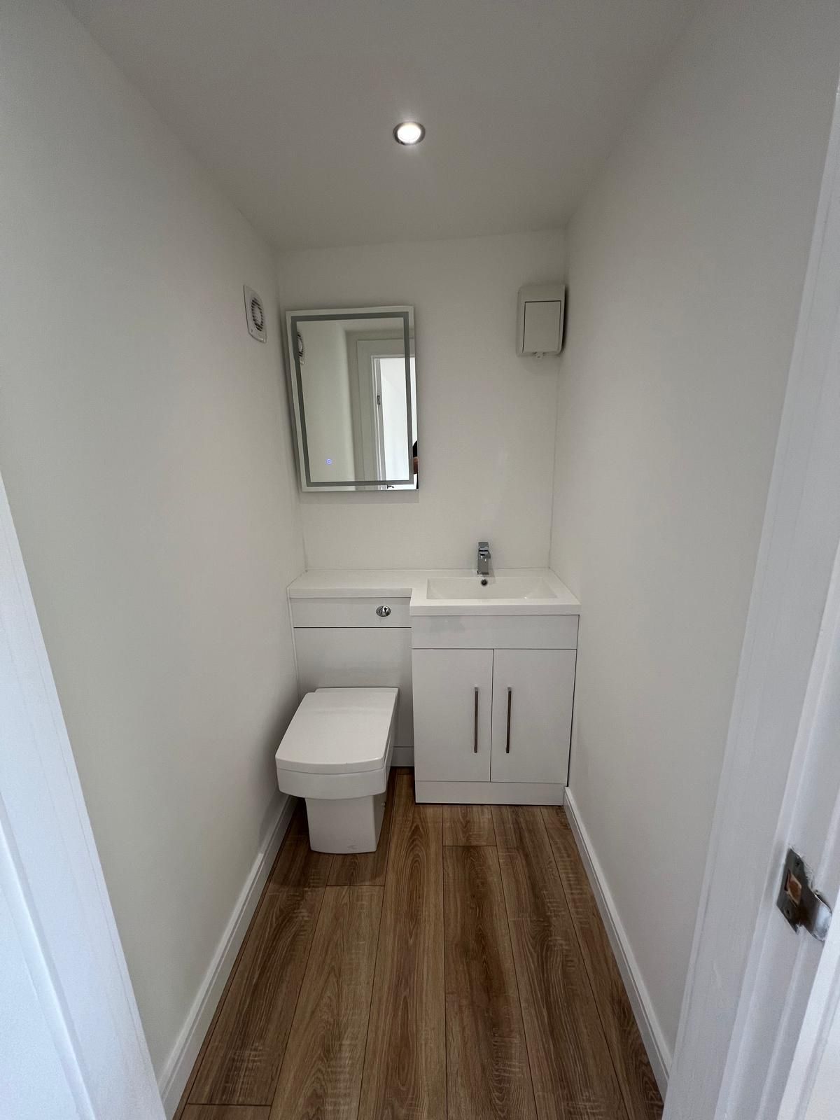 WC basin and Saniflo pumping system inside an Oakspan garden room in Newton Mearns