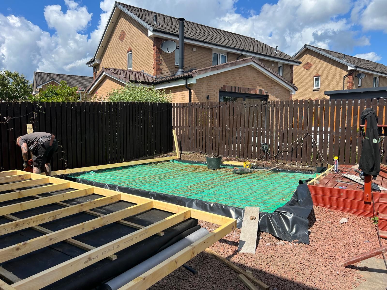 Oakspan Compacted Sub-Base And Steel Mesh Preparation Scotland Compacted sub-base and reinforced steel mesh being prepared for an Oakspan concrete garden room base in Scotland