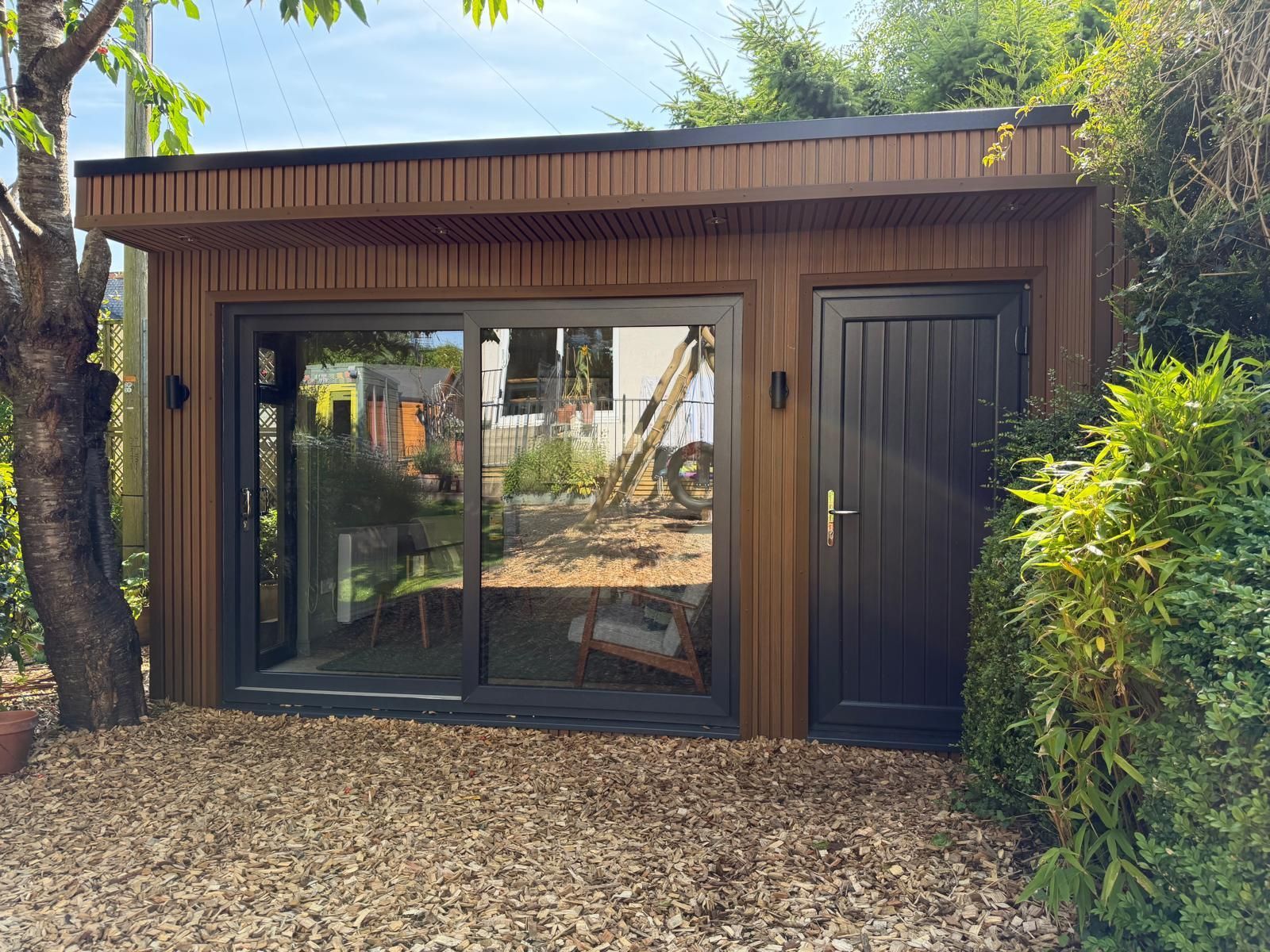 Garden Office With Side Storage Front View Front view of an Oakspan garden office with integrated side storage