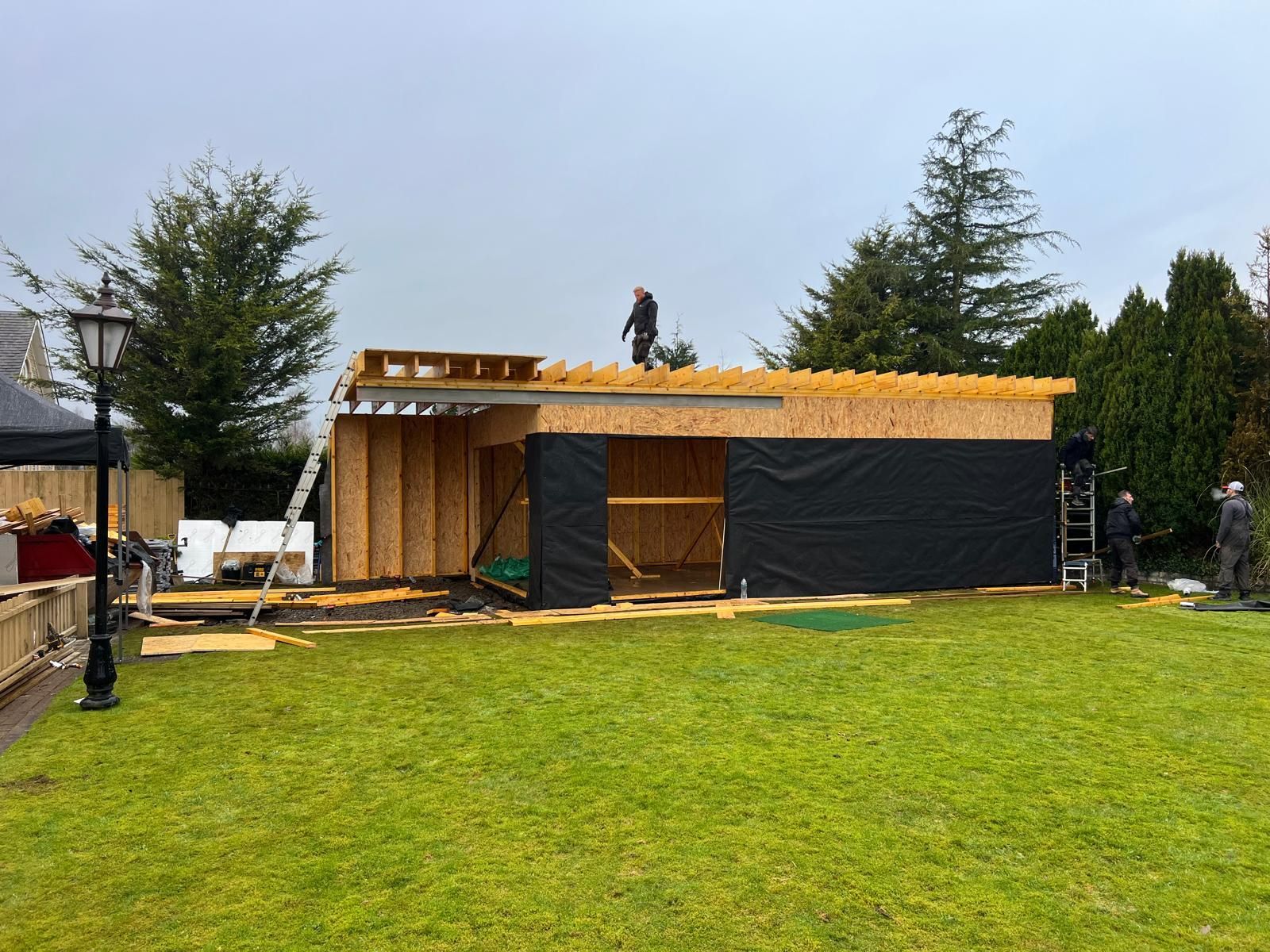Oakspan Garden Room Roof Construction Scotland Timber roof joists being installed on an Oakspan garden room in Scotland