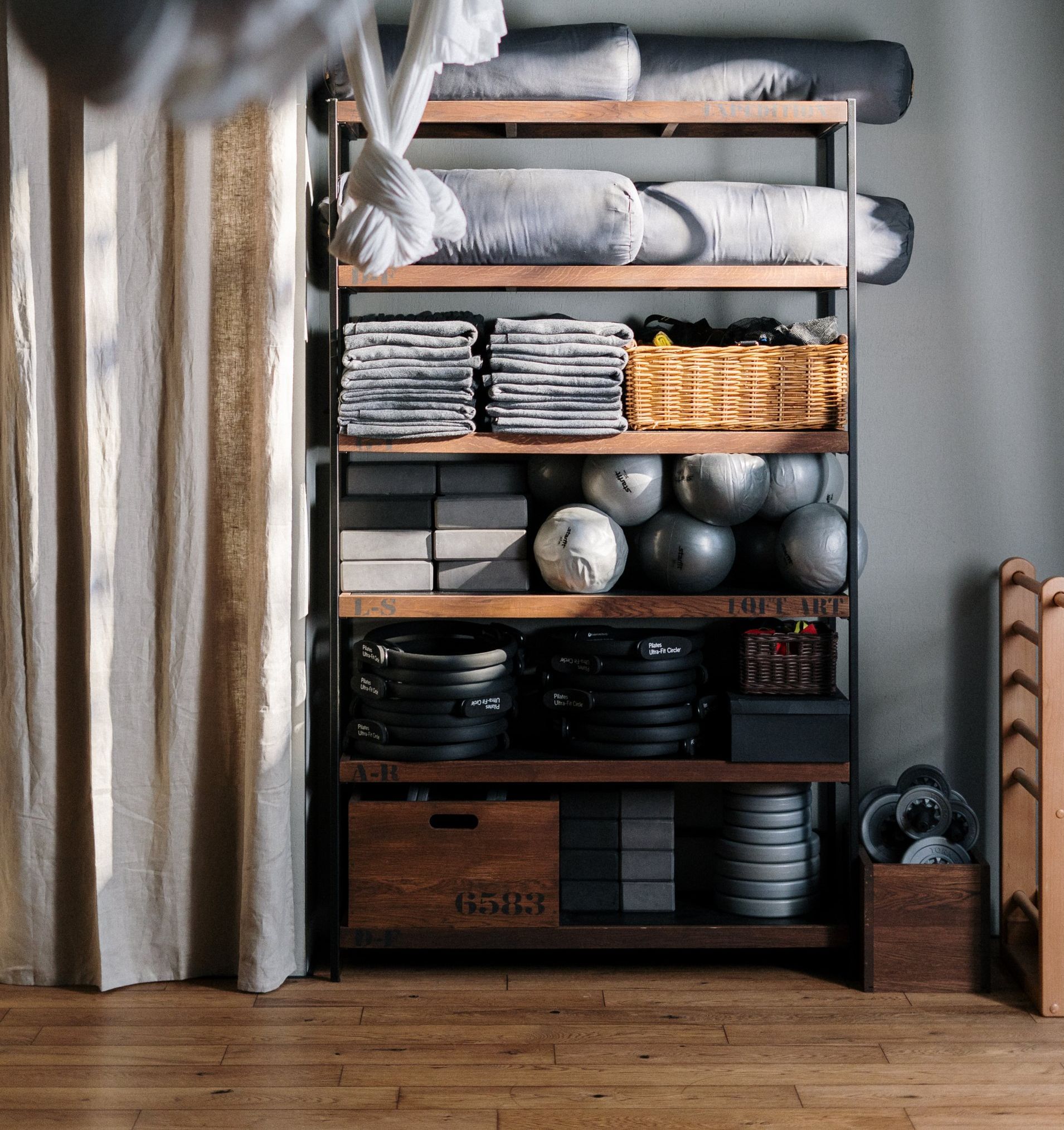 a shelf with garden room gym equipment