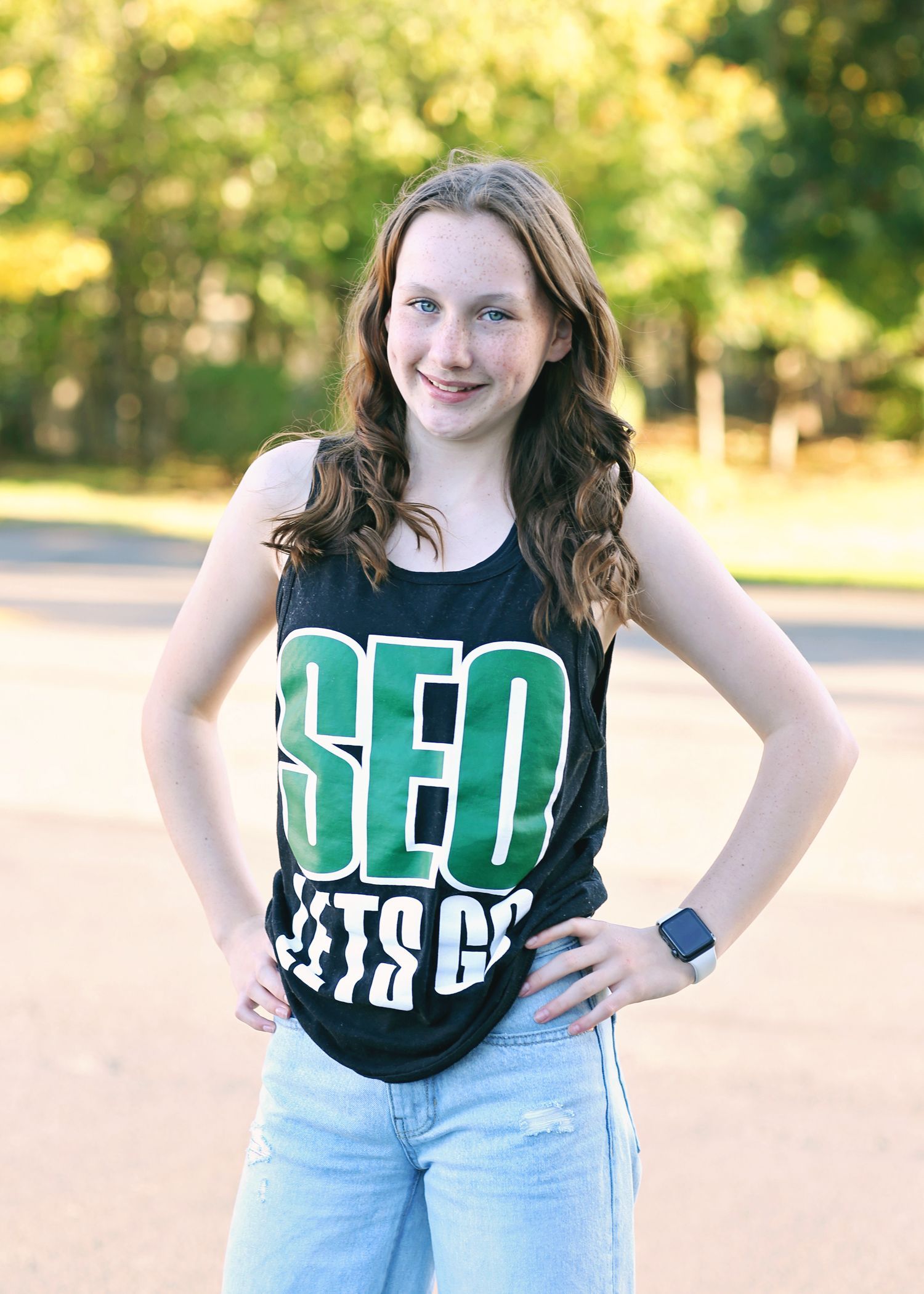 Girl with curly hair wearing a black 