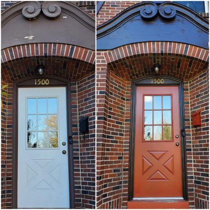 Two neighboring brick entryways, one with a light blue door and one with an orange door, both under arched stone trim