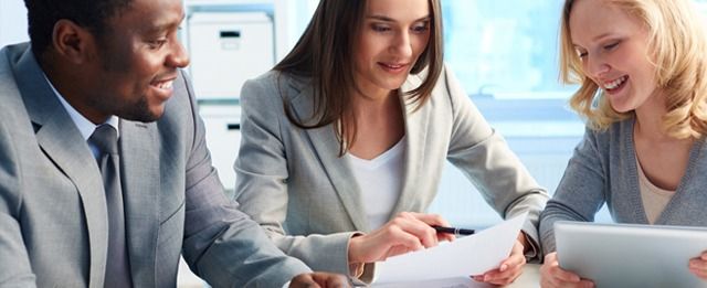 Group of people looking into the best government approved accounting software for their firm.