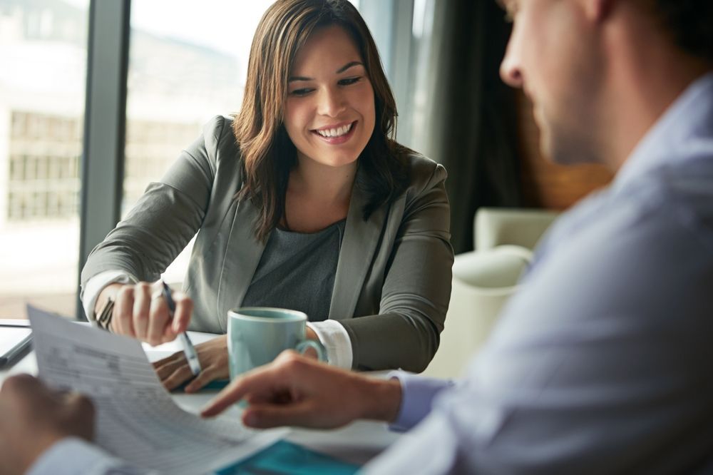 Outsourced CFO reviews documents on the benefits of outsourcing accounting services.