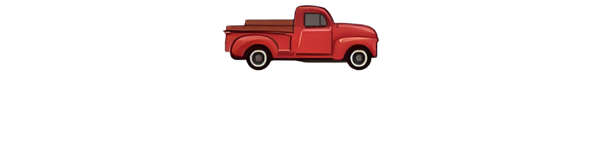 A red truck is driving on a white background.