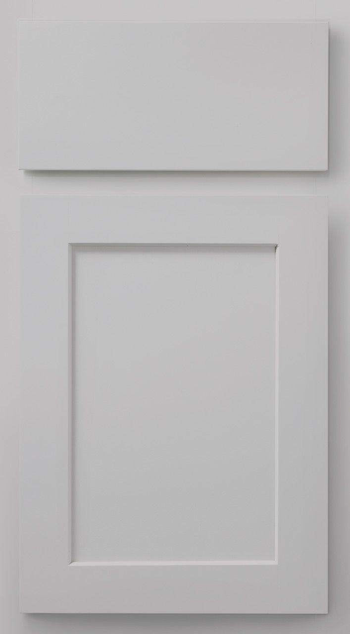 White paneled cabinet door with a smaller horizontal drawer above it