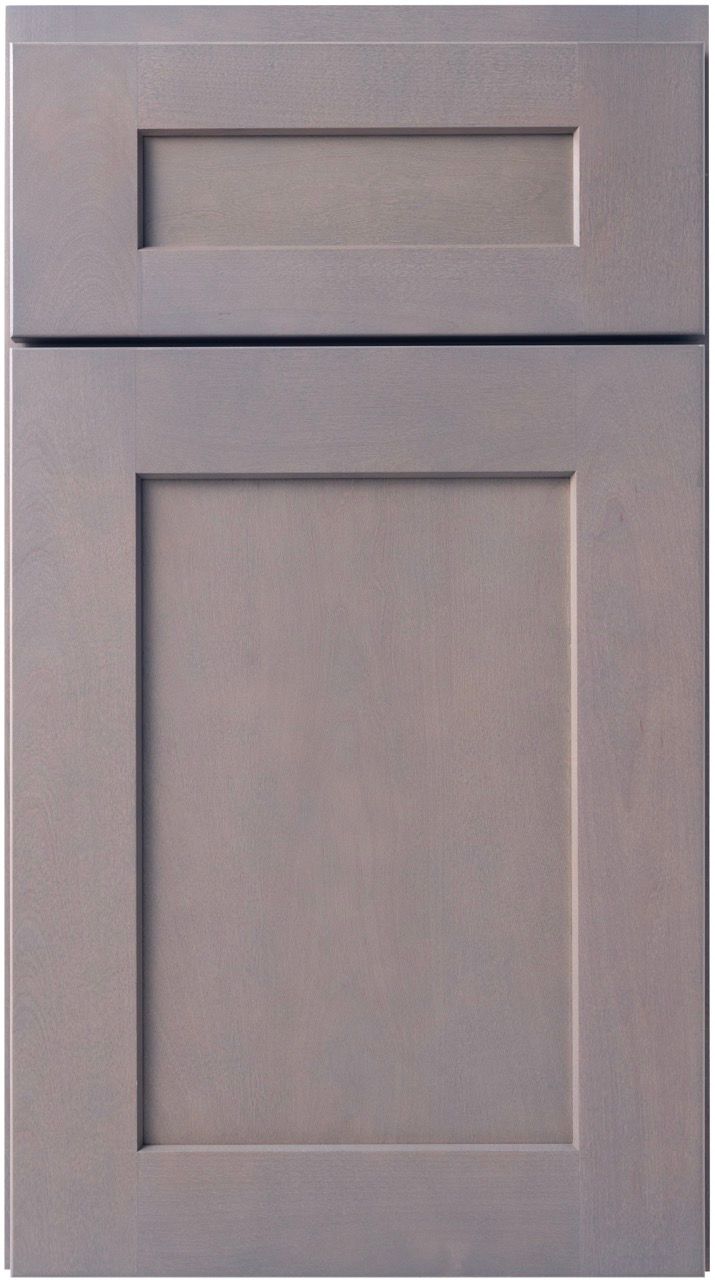 Gray cabinet door with a small top drawer and a larger lower panel.