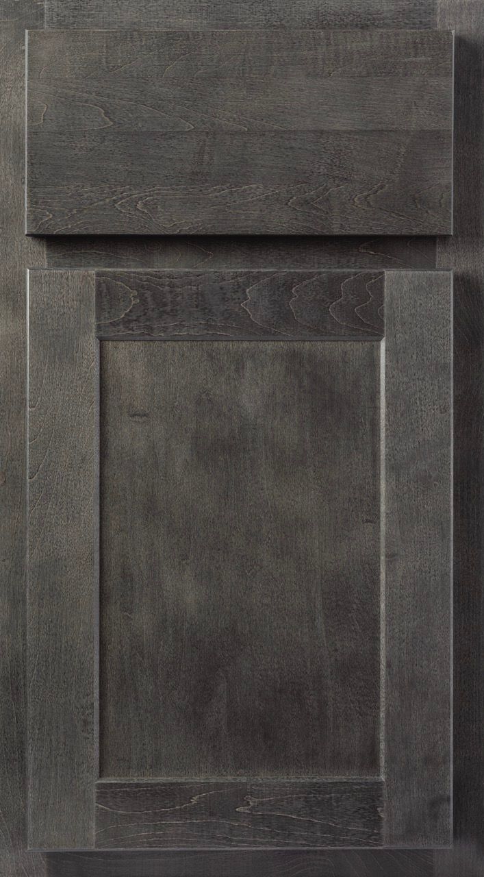 Dark gray cabinet door with a raised rectangular panel and top drawer front