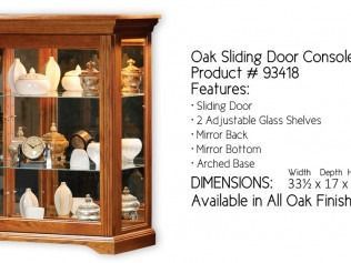 Oak sliding-door console cabinet with glass shelves and mirror back, shown in a product ad.