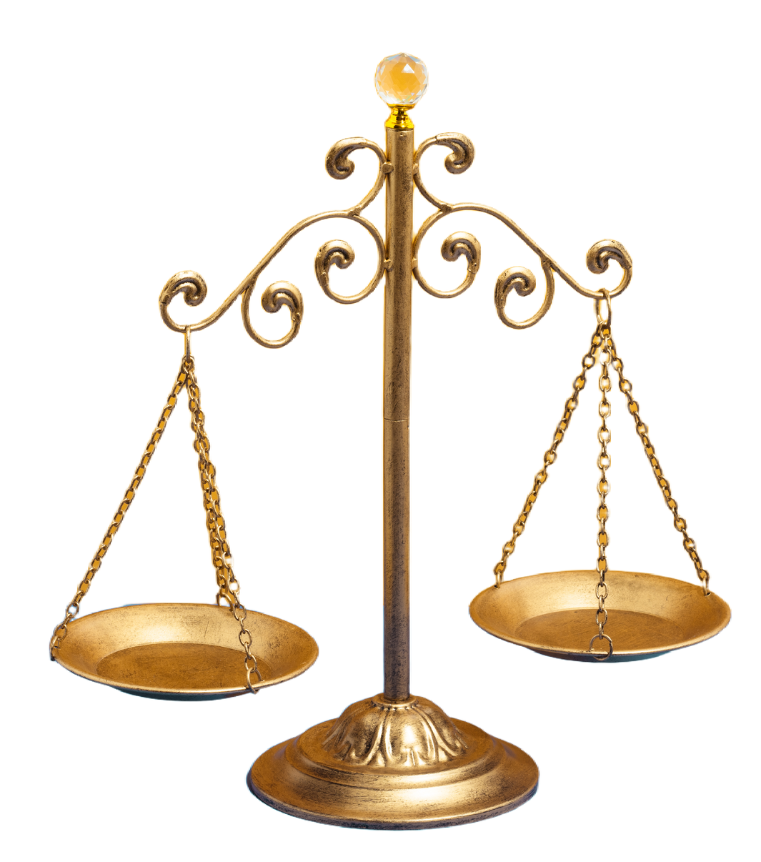 Decorative gold balance scale with two hanging pans on a pedestal base