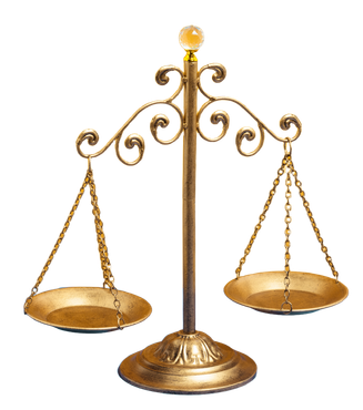 Gold balance scale on a stand with ornate arms and two hanging pans