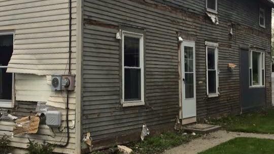 a very old house with a lot of windows and doors .