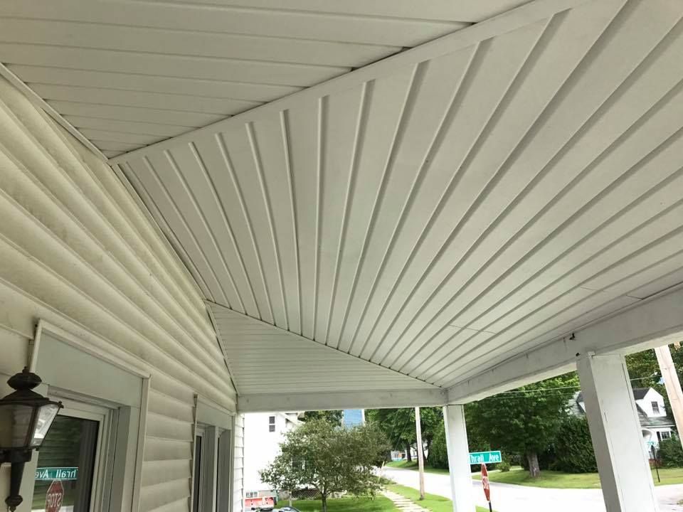 the ceiling of a porch with a vaulted ceiling .