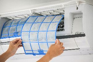 Man Hand Holding an Air Conditioner Filter — Nicholasville, KY — Stewart Air Conditioning & Heating Man Hand Holding an Air Conditioner Filter — Nicholasville, KY — Stewart Air Conditioning & Heating