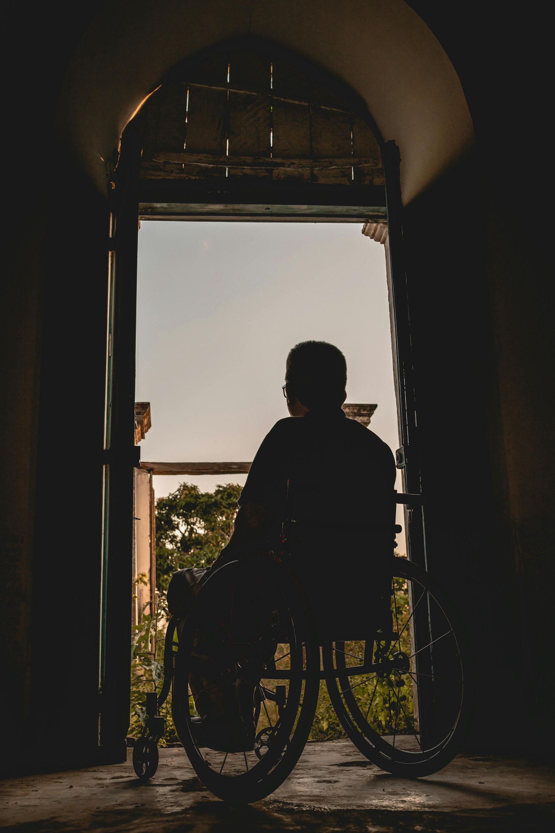 men on a wheelchair at home