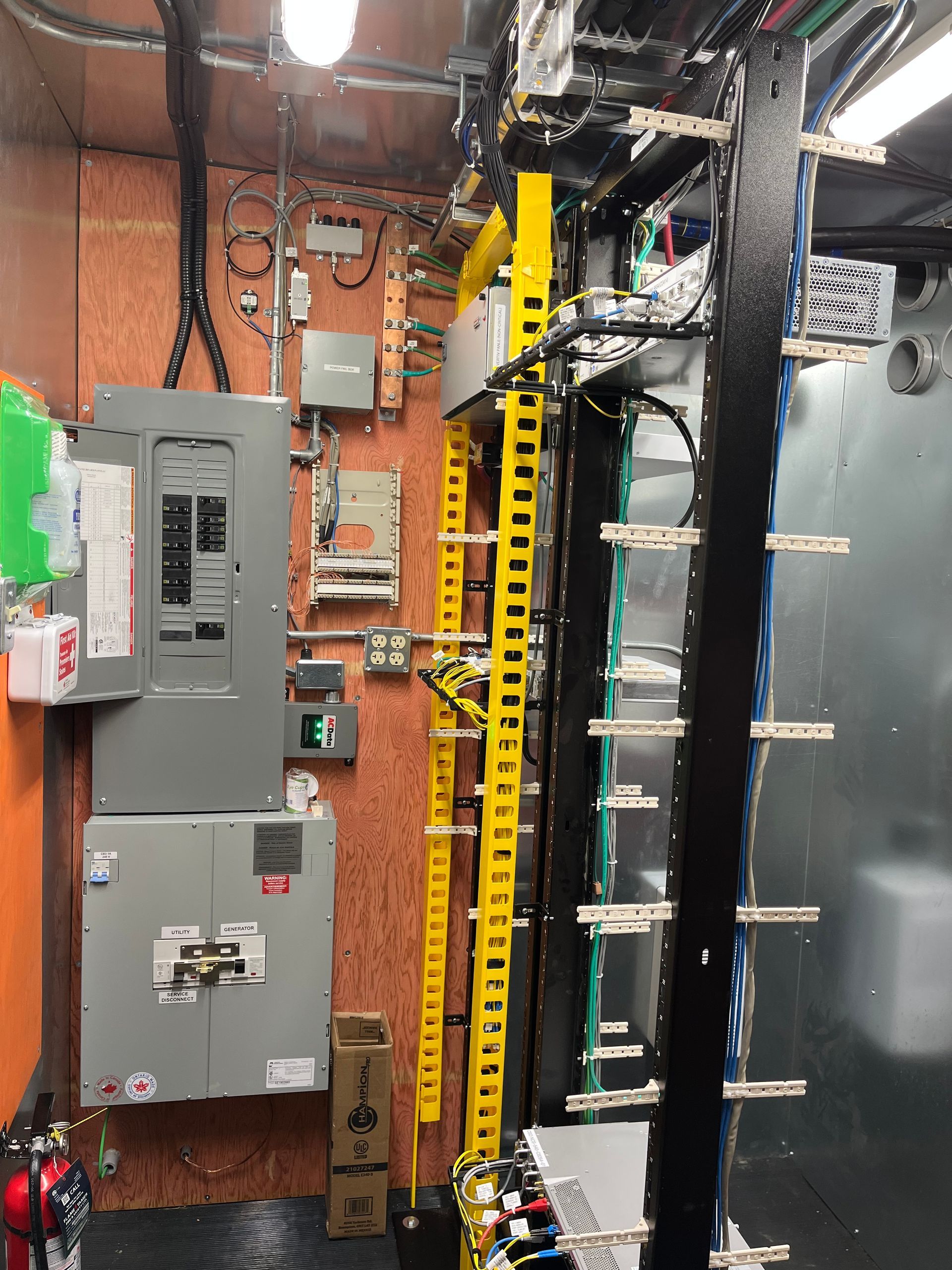 A room with a lot of electrical boxes and wires