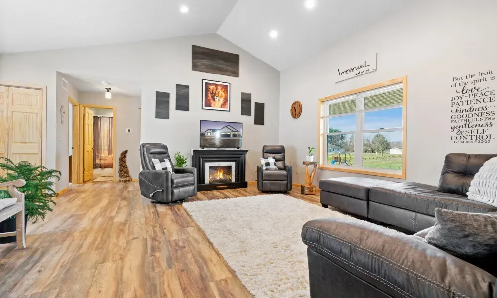 A living room filled with furniture and a fireplace.