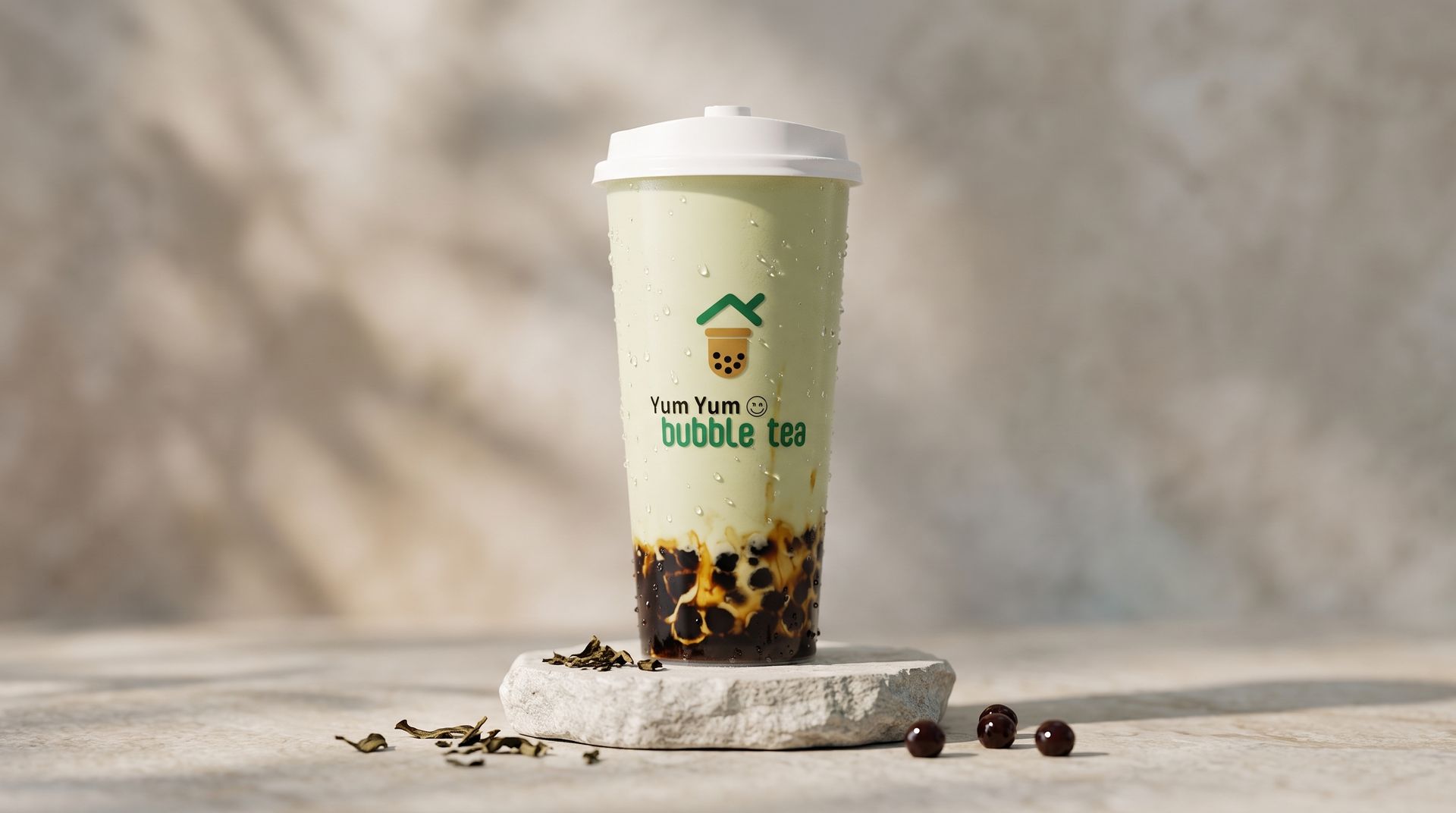 Bubble tea cup with green logo and tapioca pearls on a stone pedestal against a beige backdrop