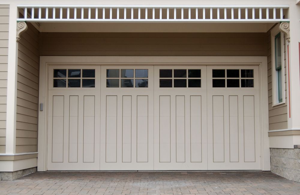 Beige Garage Door with Square Glass Panels and Decorative Trim — Complete Sheds In Campbelltown, NSW