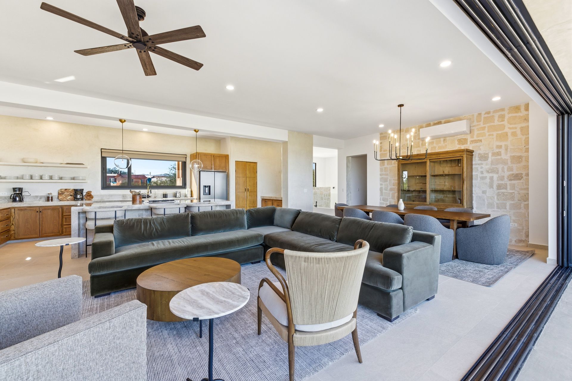 Spacious living room with indoor-outdoor design overlooking the Sea of Cortez.