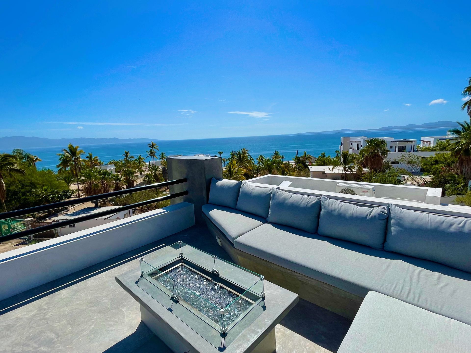 Private rooftop terrace with lounge seating and panoramic Sea of Cortez views.