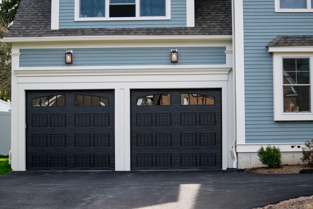 Two Dark Wood Garage Doors Side By Side — Gold Coast Door Centre In Burleigh Heads, QLD