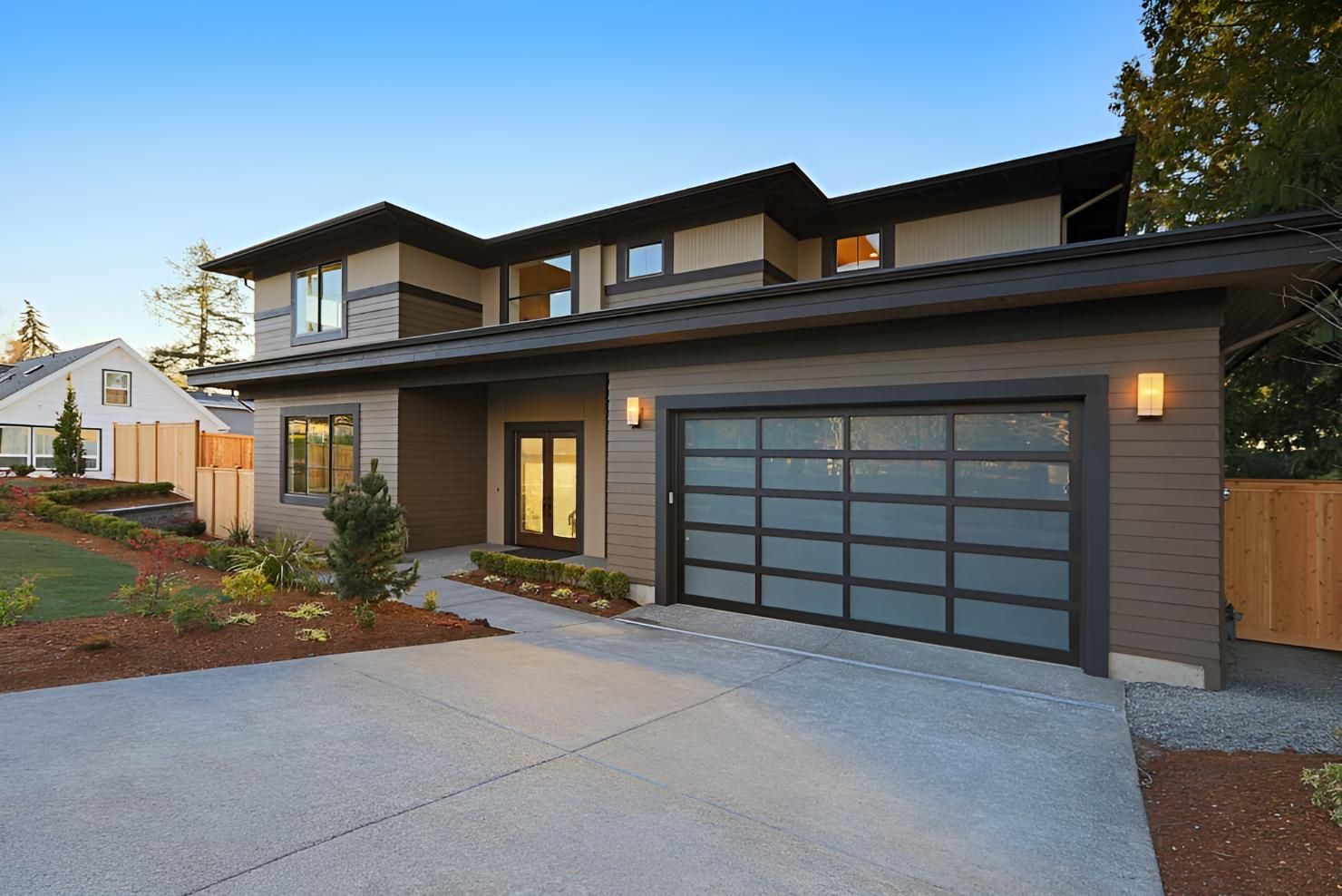 A Large House With A Garage Door And A Driveway — Gold Coast Door Centre In Burleigh Heads, QLD