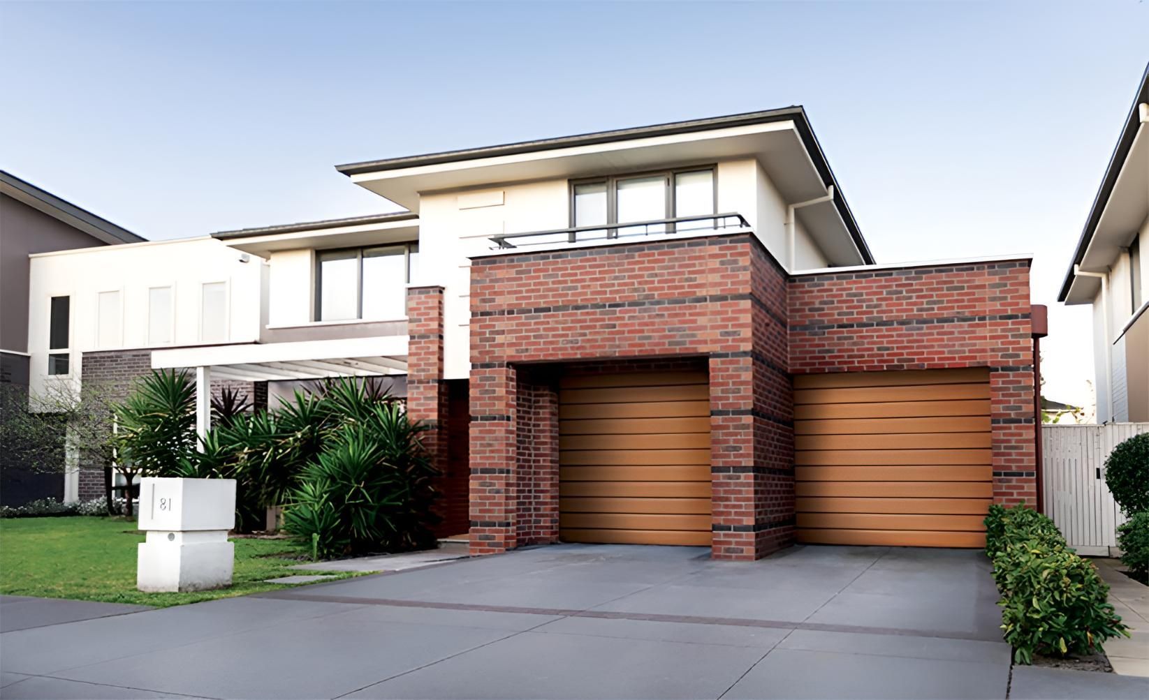 A Brick House With A Wooden Garage Door — Gold Coast Door Centre In Burleigh Heads, QLD