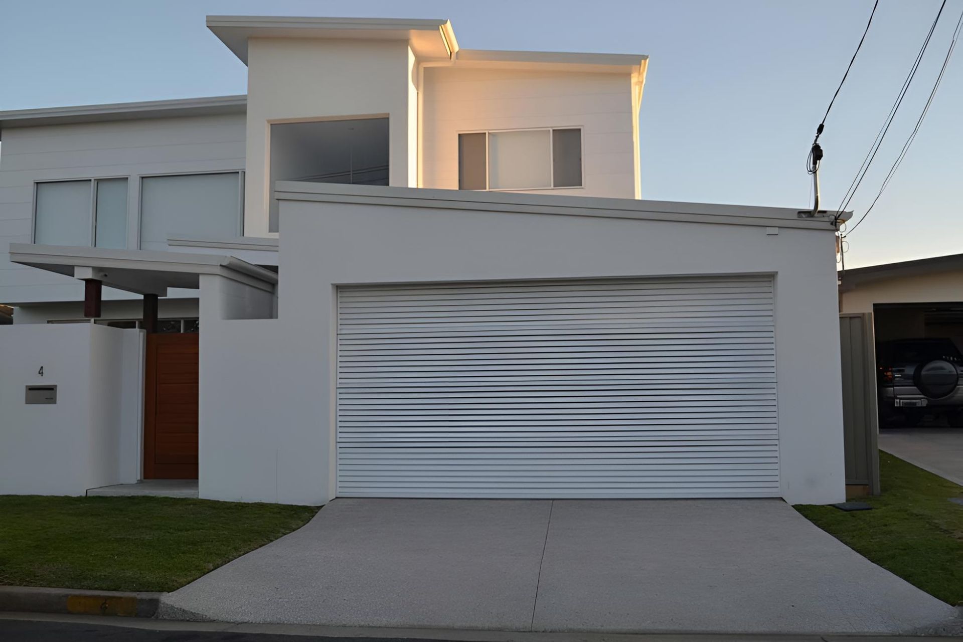A White House With A White Garage Door — Gold Coast Door Centre In Burleigh Heads, QLD