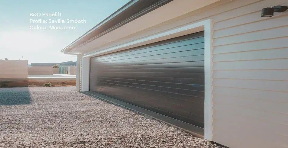 Garage with A Dark Gray Roller Door on A Building — Gold Coast Door Centre In Burleigh Heads, QLD