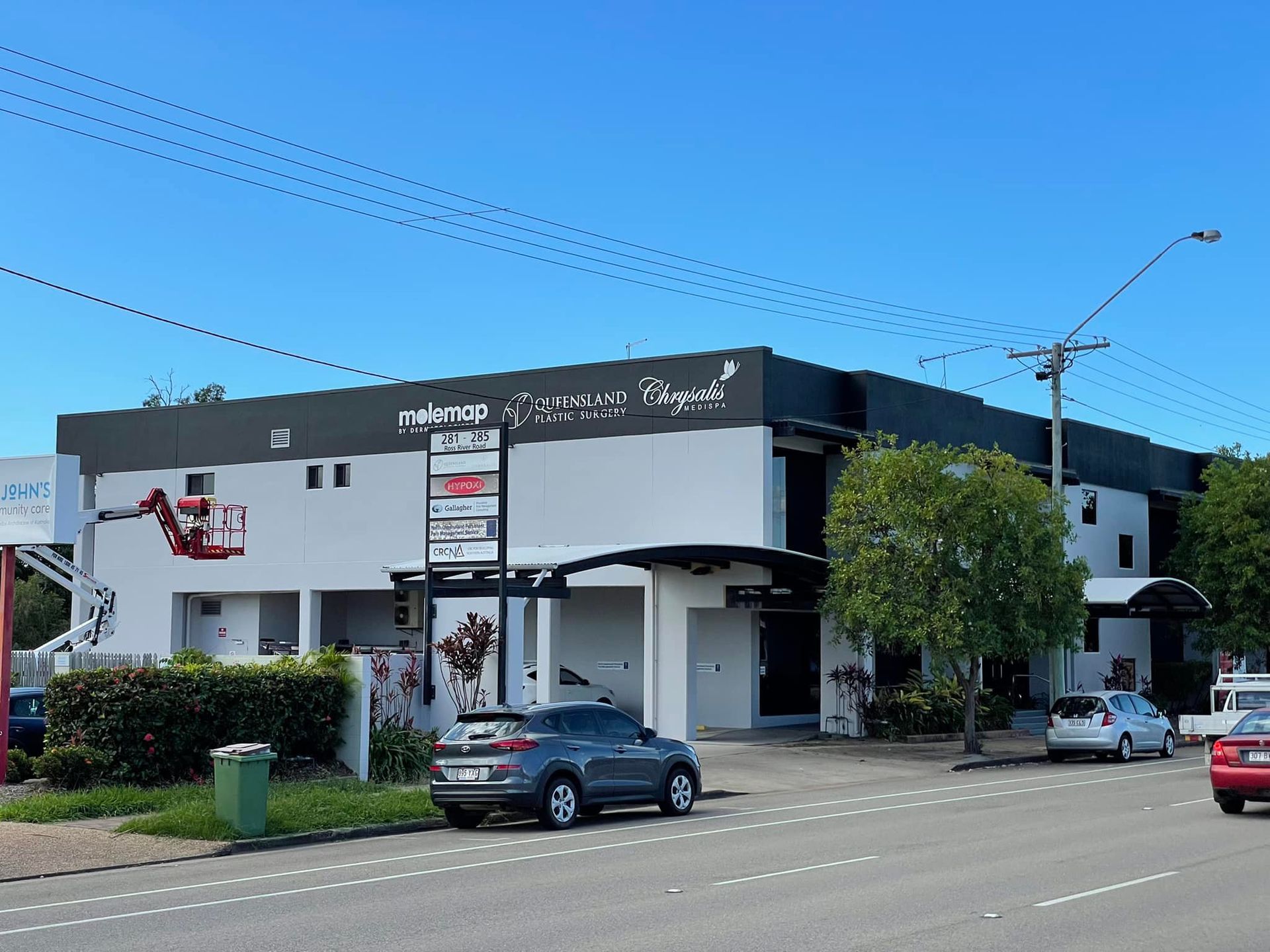 A Large Building With A Painted Roof — Marteene Painting Services In Kirwan, QLD