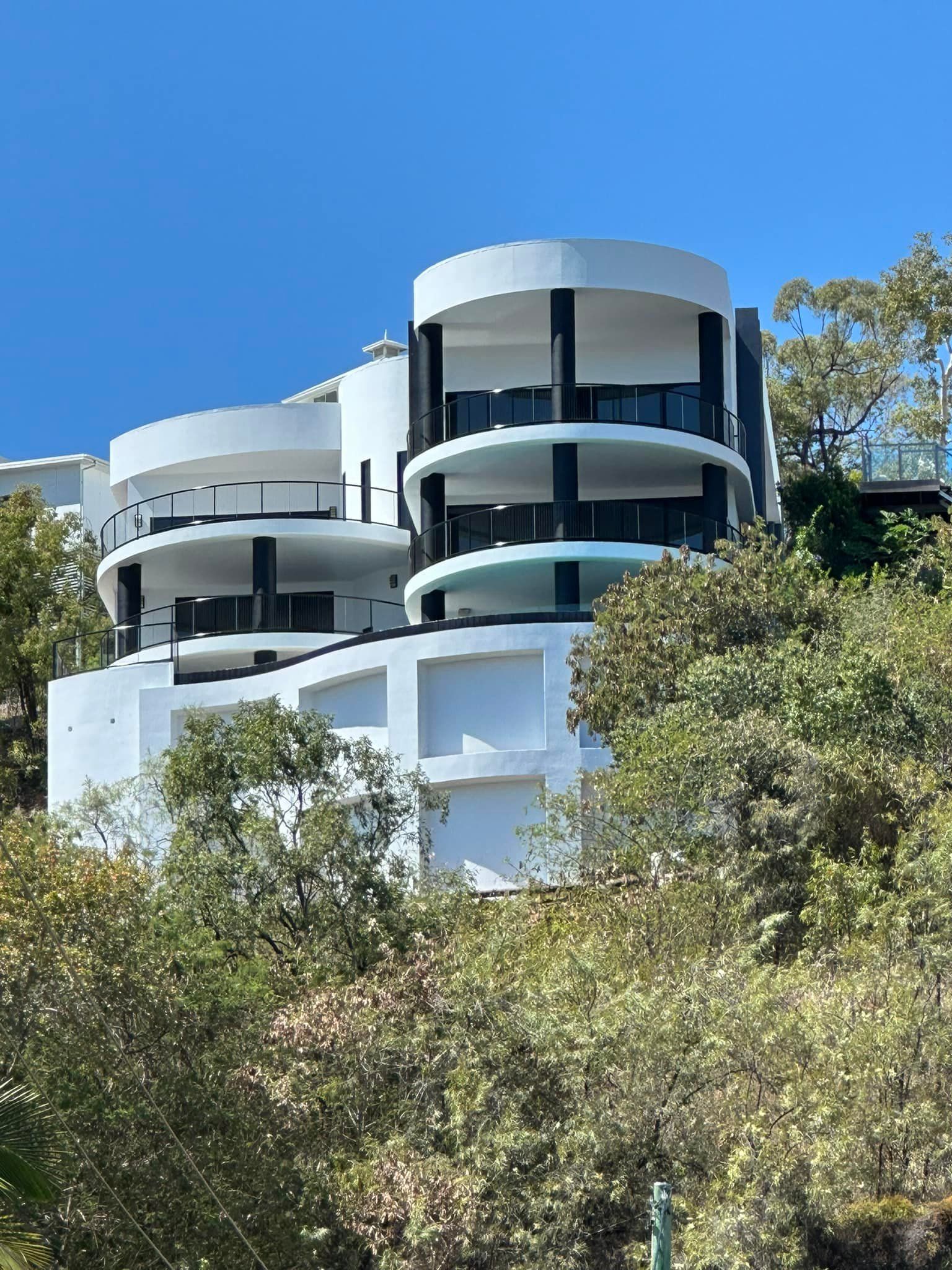 A Newly Painted Building With Trees Surrounding — Marteene Painting Services In Kirwan, QLD