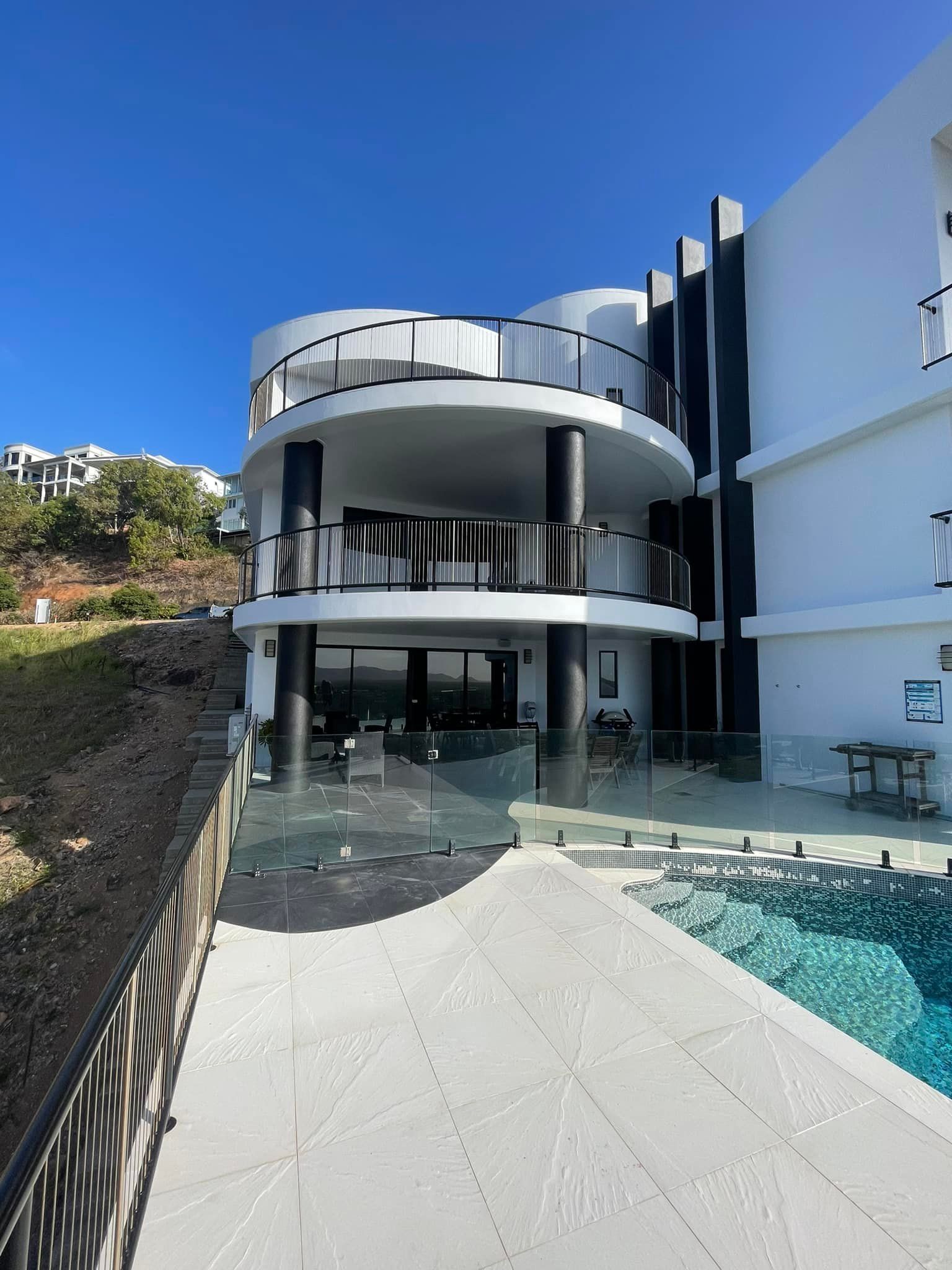 A Newly Painted White House With A Swimming Pool — Marteene Painting Services In Kirwan, QLD