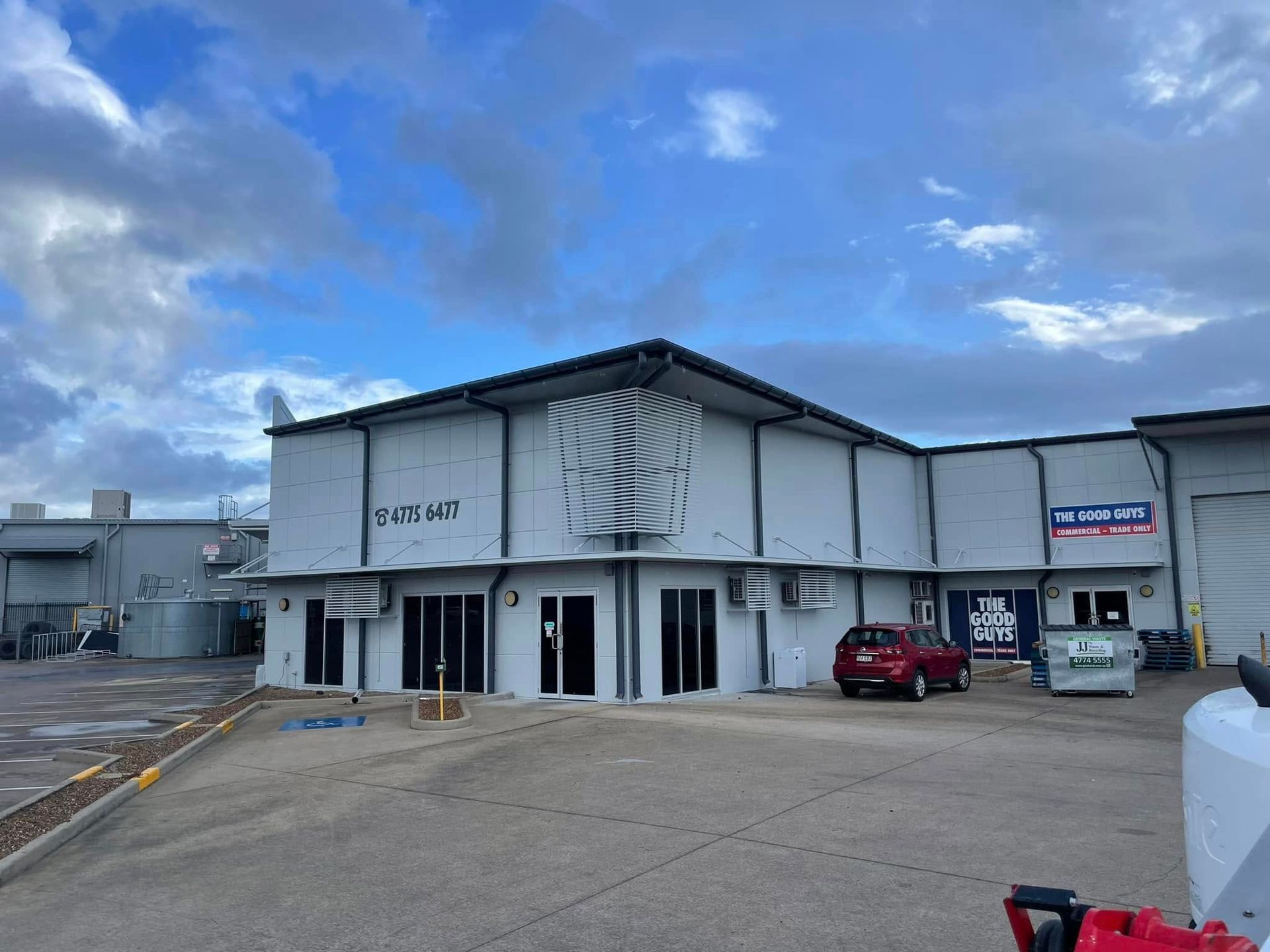 A White Painted Building With A Brand Sign — Marteene Painting Services In Kirwan, QLD