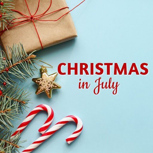 Christmas in July text with candy canes, pine branches, gift wrap, and a star ornament on a blue background